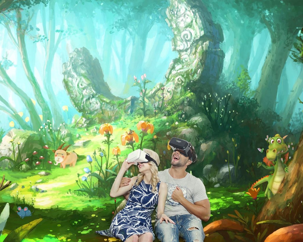 Imagem ilustrativa: metaverso
casal em ambiente de floresta, usando &oacute;culos de realidade virtual